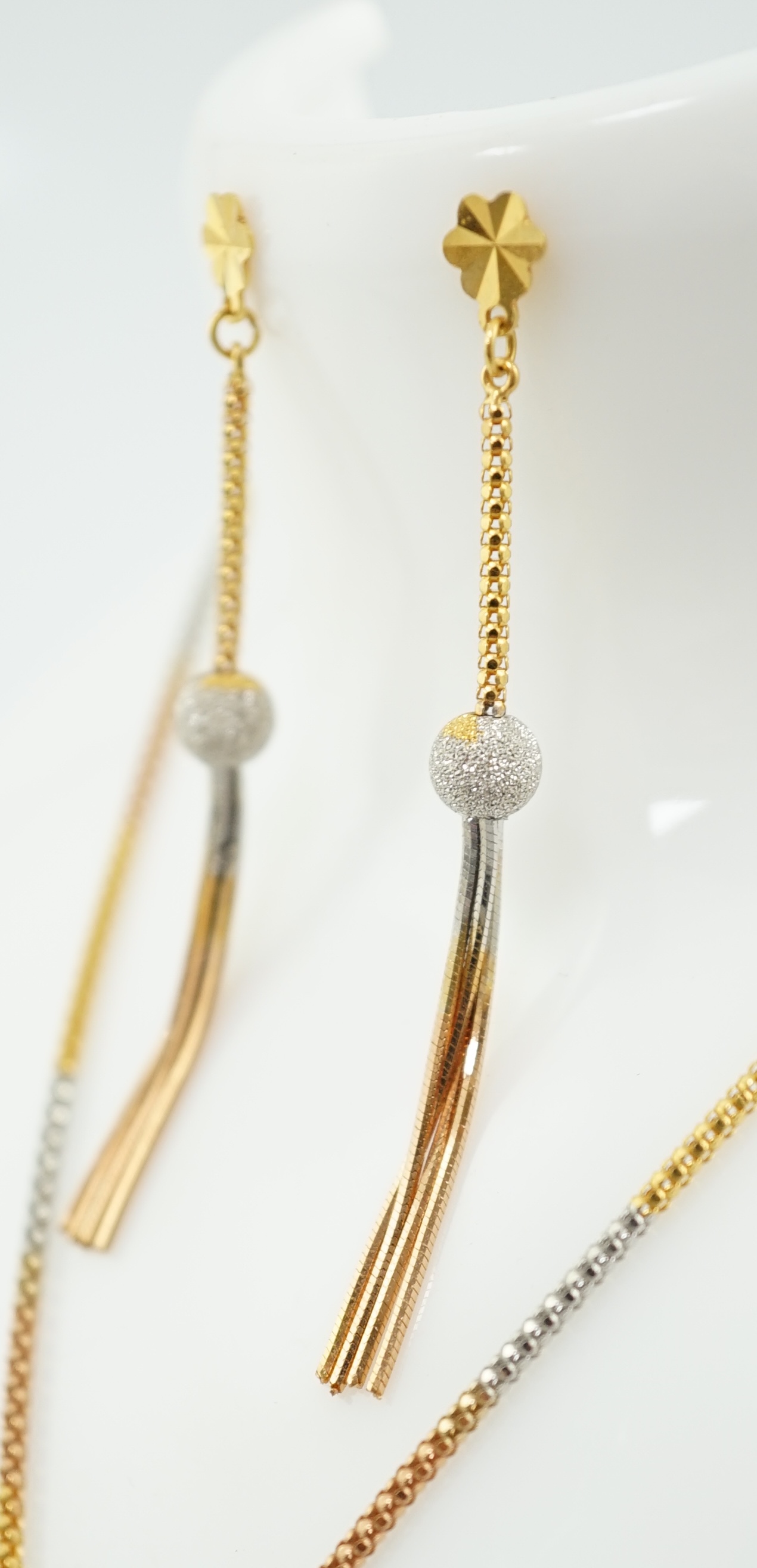 A recent Middle Eastern three colour 22k gold tassel drop necklace and pair of matching drop earrings